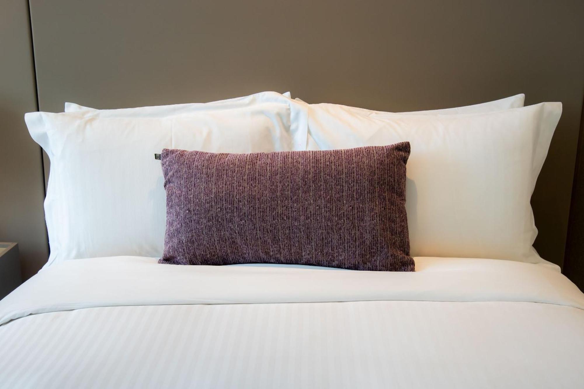Camino Real Fashion Drive Monterrey San Pedro Garza Garcia Exterior foto A bed with pillows